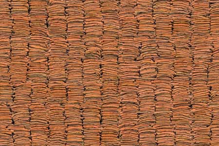 A close-up shot of folded prison uniforms